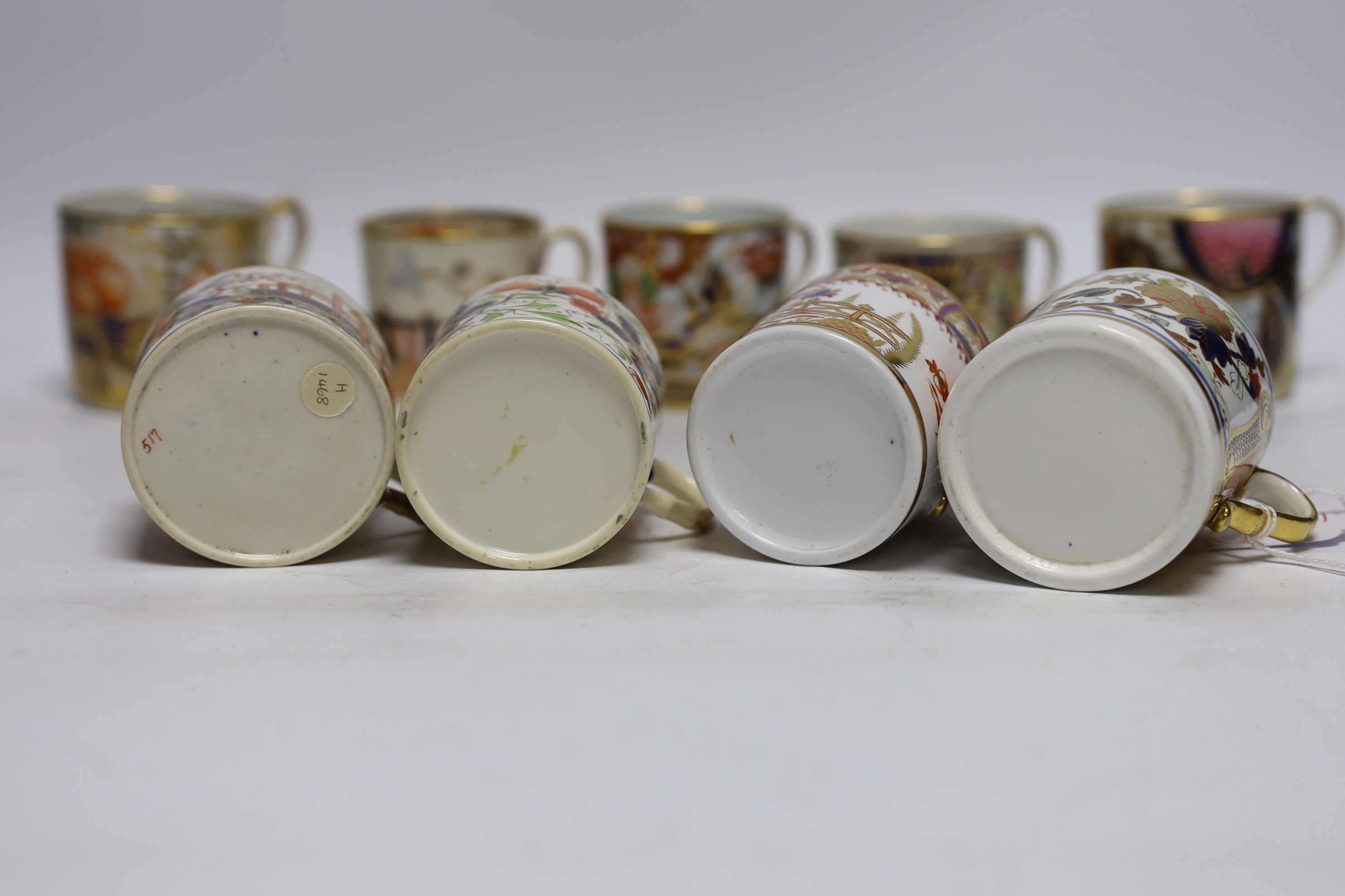 Twelve 1800-1820 English porcelain coffee cans, including Imari pattern examples